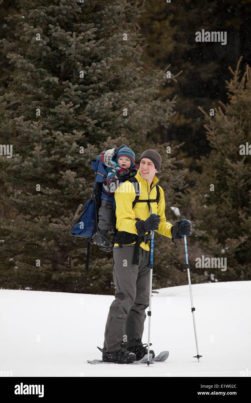 A father and a newborn boy going for a snowshoe at Peter Lougheed Provincial Park,  Kananaskis, AB Stock Photo