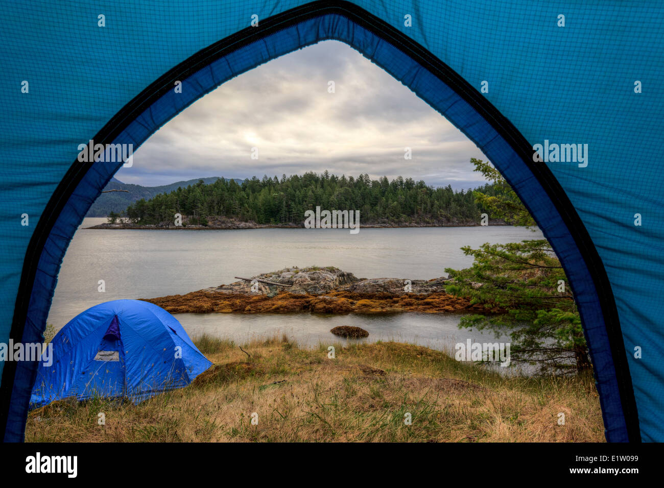 Kayakers camp on Penn Island in Sutil Channel between Read and Cortes Islands British Columbia Canada. Stock Photo