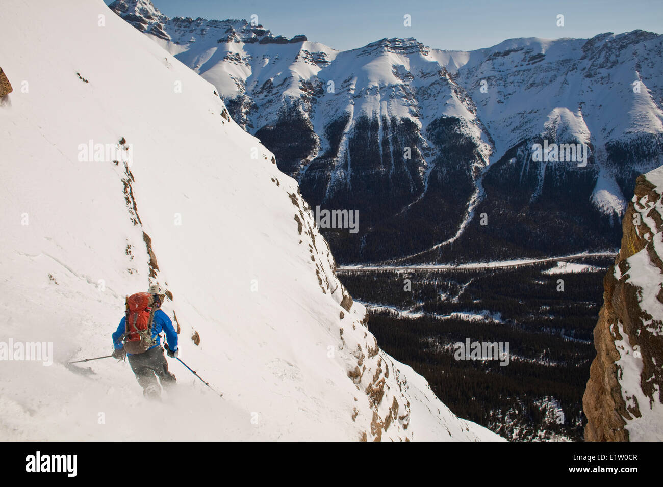 A male backcountry tele skier descends a coulior on Mt. Patterson, Icefields Parkway, Banff, AB Stock Photo