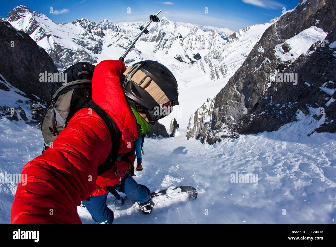 A male splitboarder captures a self portait pov while descending a steep couloir on Mt French Peter Lougheed Provincial Park Stock Photo