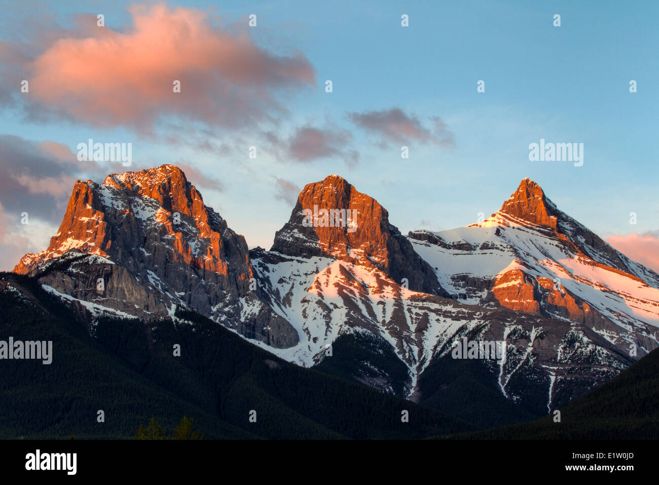 The Three Sisters Mountain Peaks at sunrise, Canmore, Alberta, Canada Stock Photo