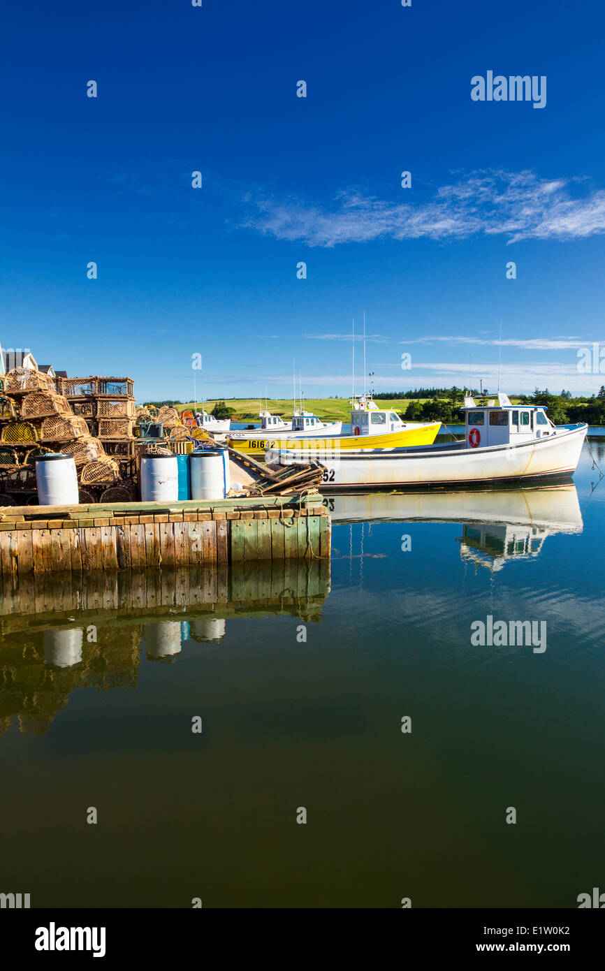 Lobster traps and fishing boats, French River Wharf, Prince Edward Island, Canada Stock Photo