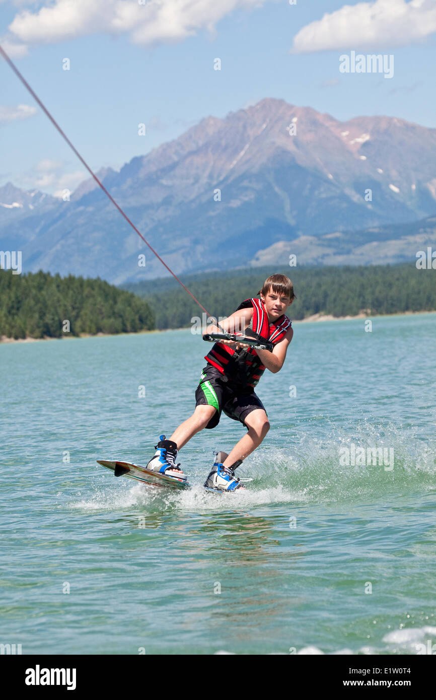 Young boy wakeboarding on Lake Koocanusa, East Kootenays, BC, Canada Stock Photo