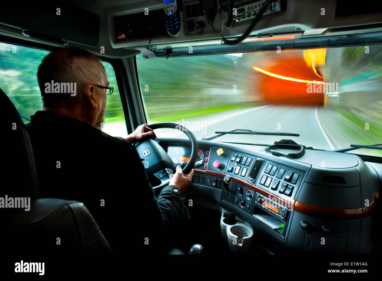 Comercial truck driver about to enter China Bar Tunnel on Highway 1. Stock Photo