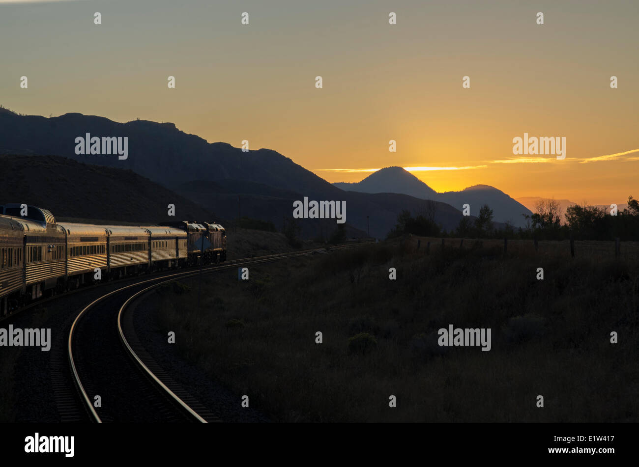 Passenger train at sunrise in kamloops hires stock photography and