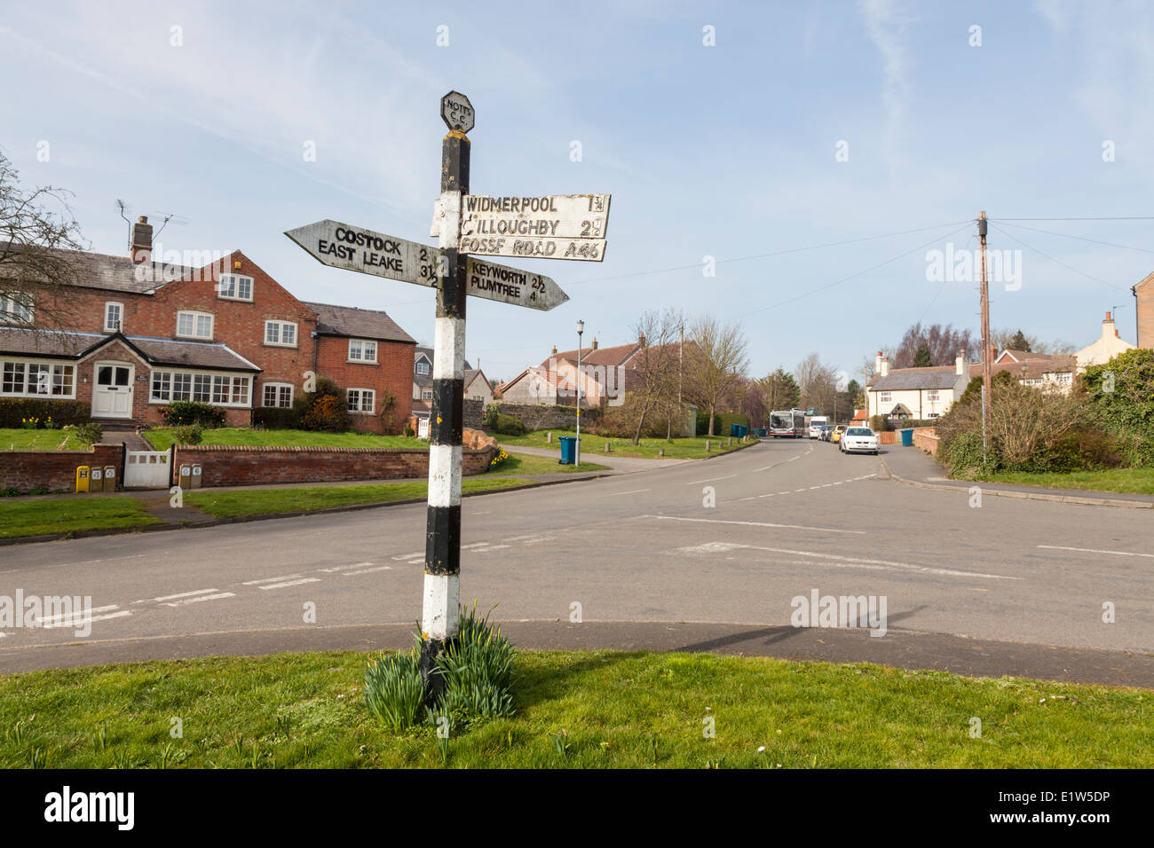 Old style directional road sign giving direction, destination and distance in miles. Wysall, Nottinghamshire, England, UK Stock Photo