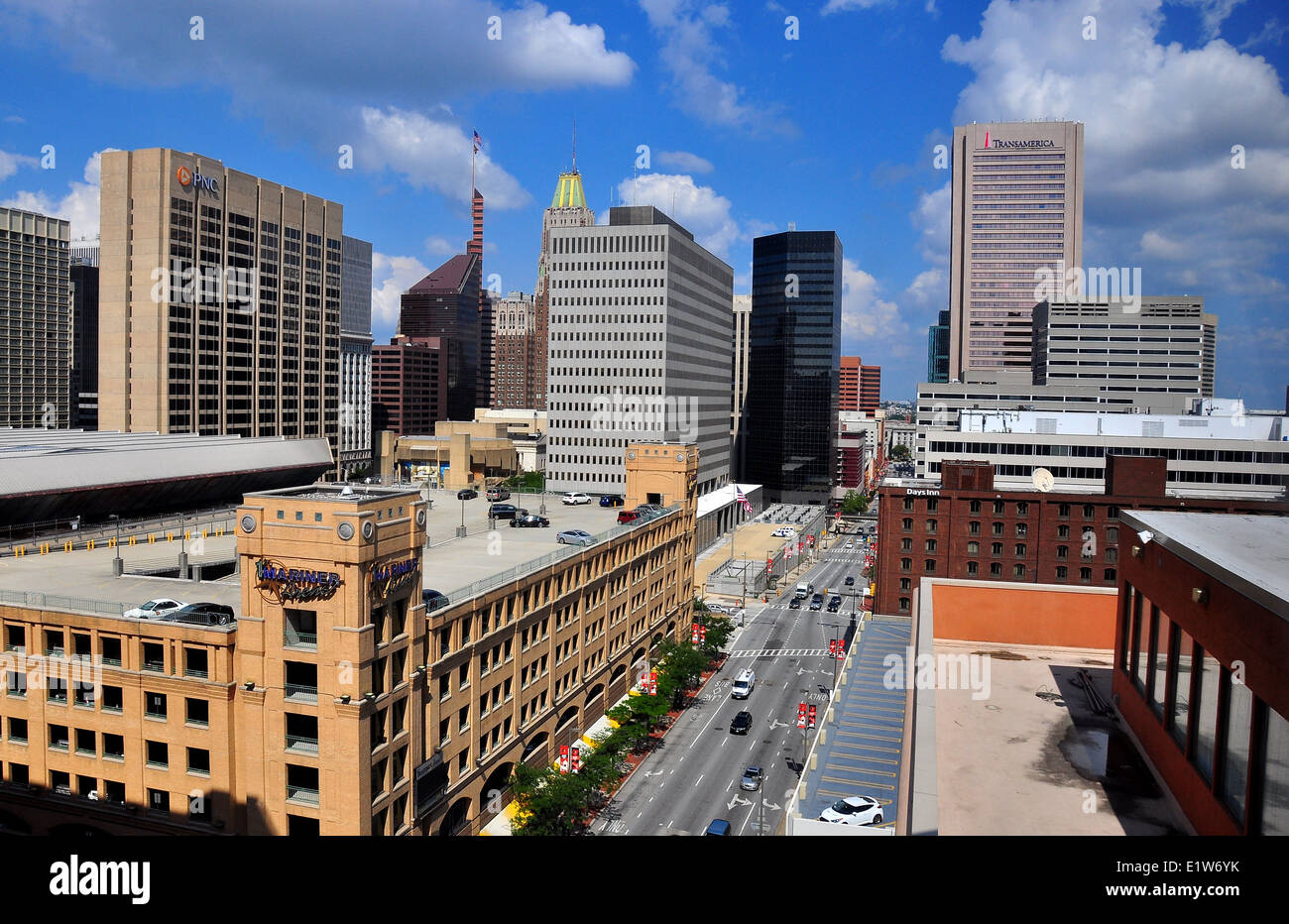Baltimore, MD: View of corporate office towers, hotels, and modern buildings lining busy Pratt Street Stock Photo