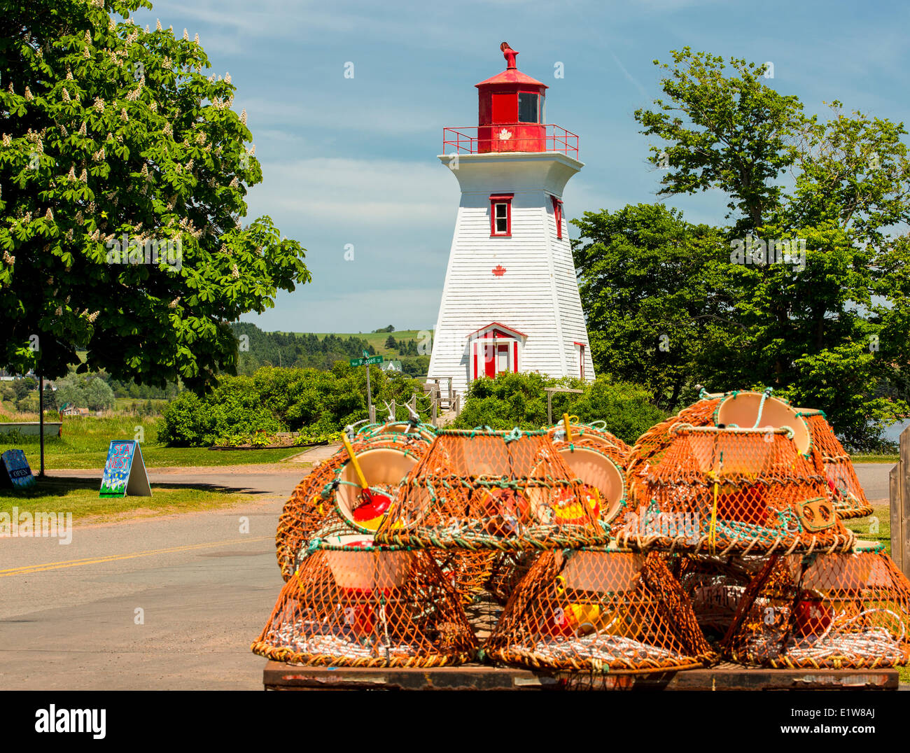 Lighthouse and crab traps, Victoria, Prince Edward Island, Canada Stock Photo
