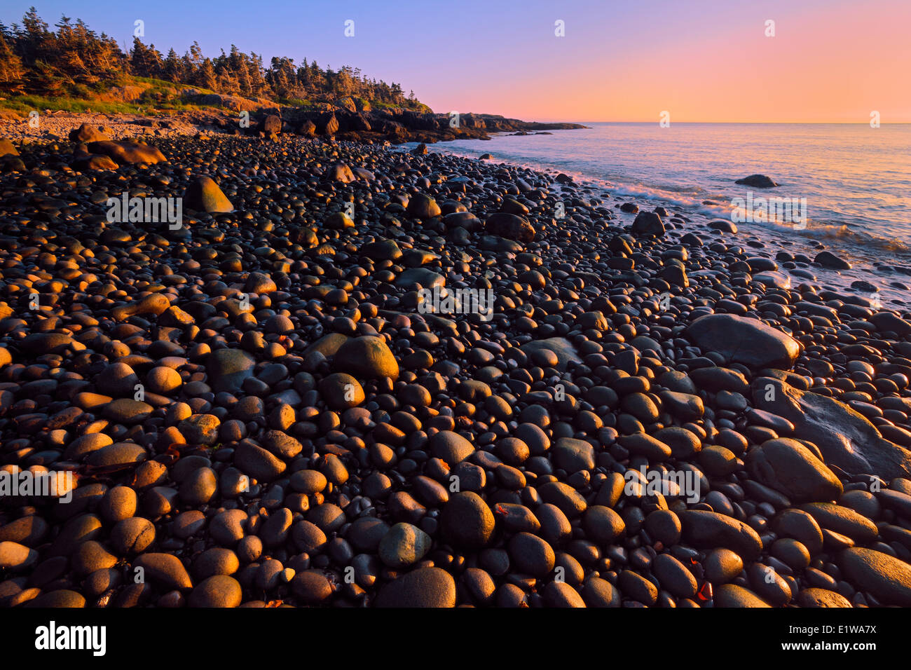 Sunset on a pebble beach at Flower's Cove, Long Island, Nova Scotia