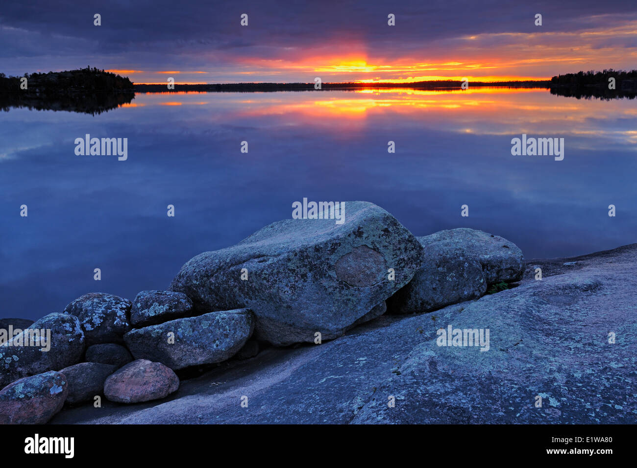 Setting sun before a storm, White Lake, Whiteshell Provincial Park, Manitoba, Canada Stock Photo