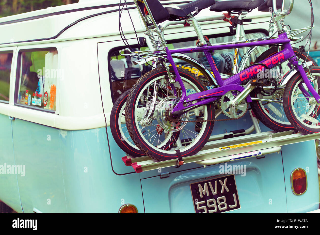 Raleigh Chopper bikes on the rear of a VW Campervan with added nostalgic filter Stock Photo