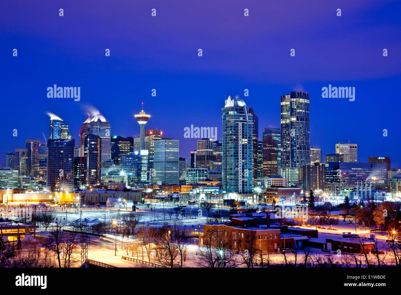 Calgary skyline at night in winter showing office towers including Bow Tower, Calgary, Alberta, Canada. Stock Photo