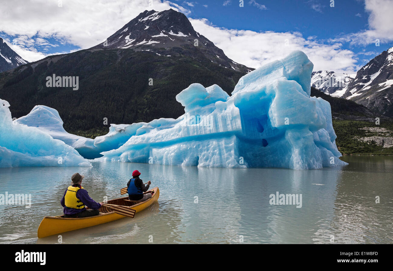 Canoeing near iceberg, Coast Mountains, British Columbia, Canada Stock