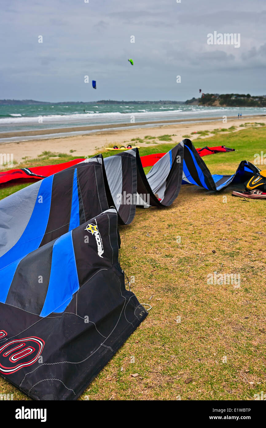 Kitesurfing along the beach in Orewa, north of Auckland, North Island