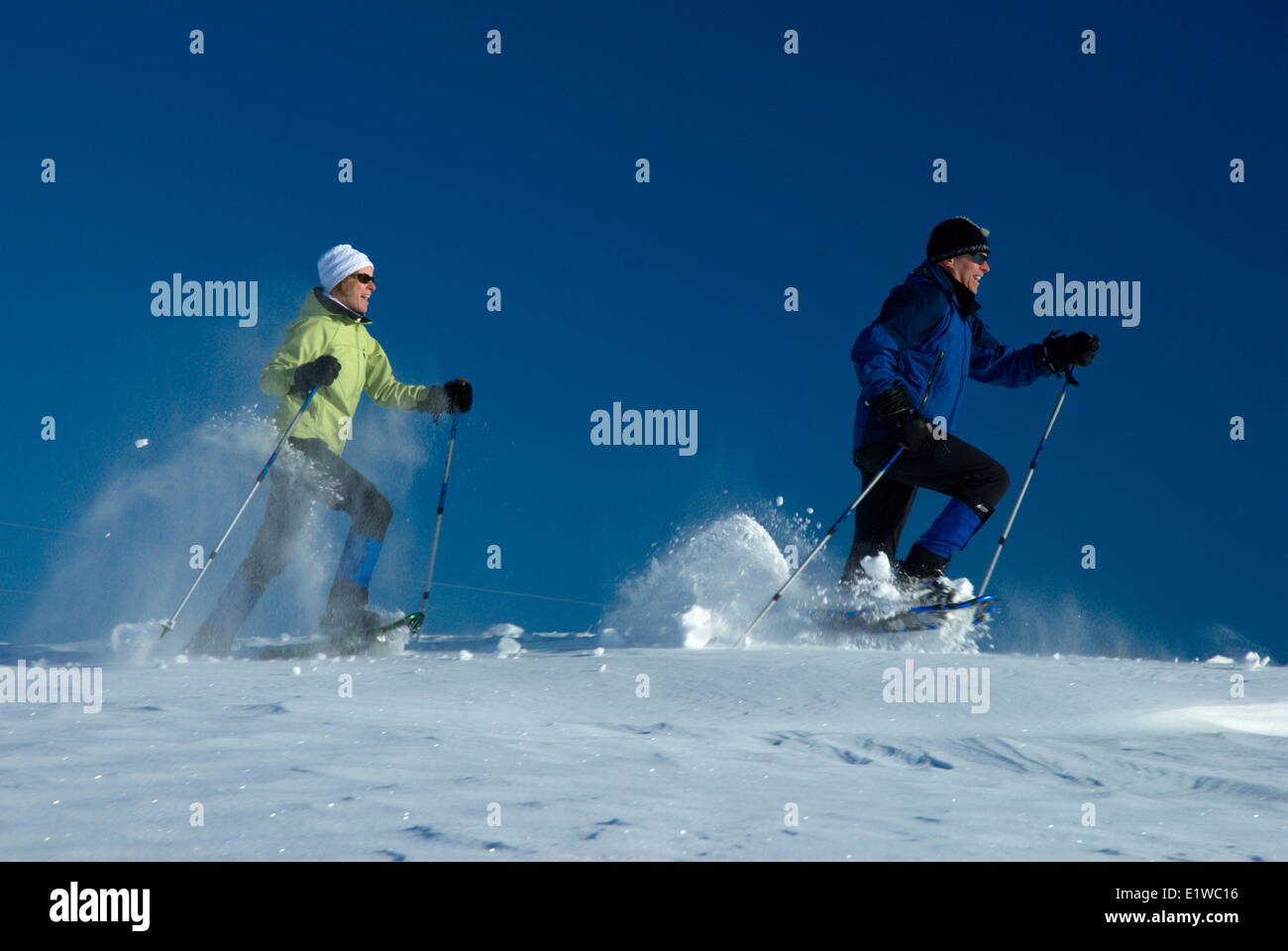 Mature couple Snowshoeing in Simcoe County, Ontario, Canada Stock Photo