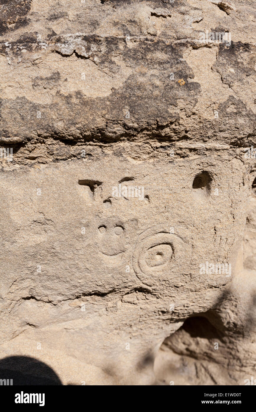 Carvings (perhaps graffiti) in sandstone in an accessible area Writing-on-Stone Provincial Park in Alberta Canada - the largest Stock Photo