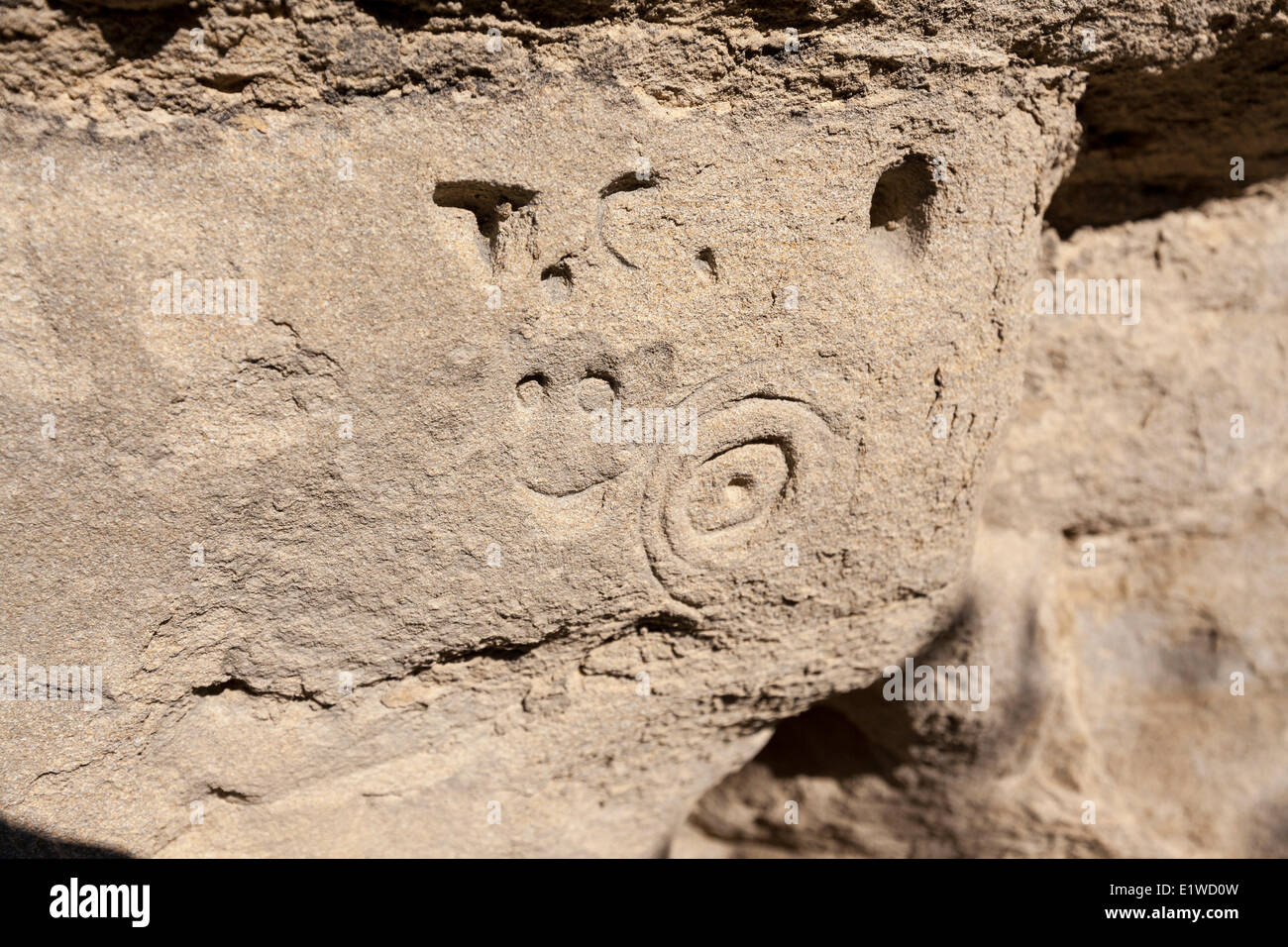 Carvings (perhaps graffiti) in sandstone in an accessible area Writing-on-Stone Provincial Park in Alberta Canada - the largest Stock Photo