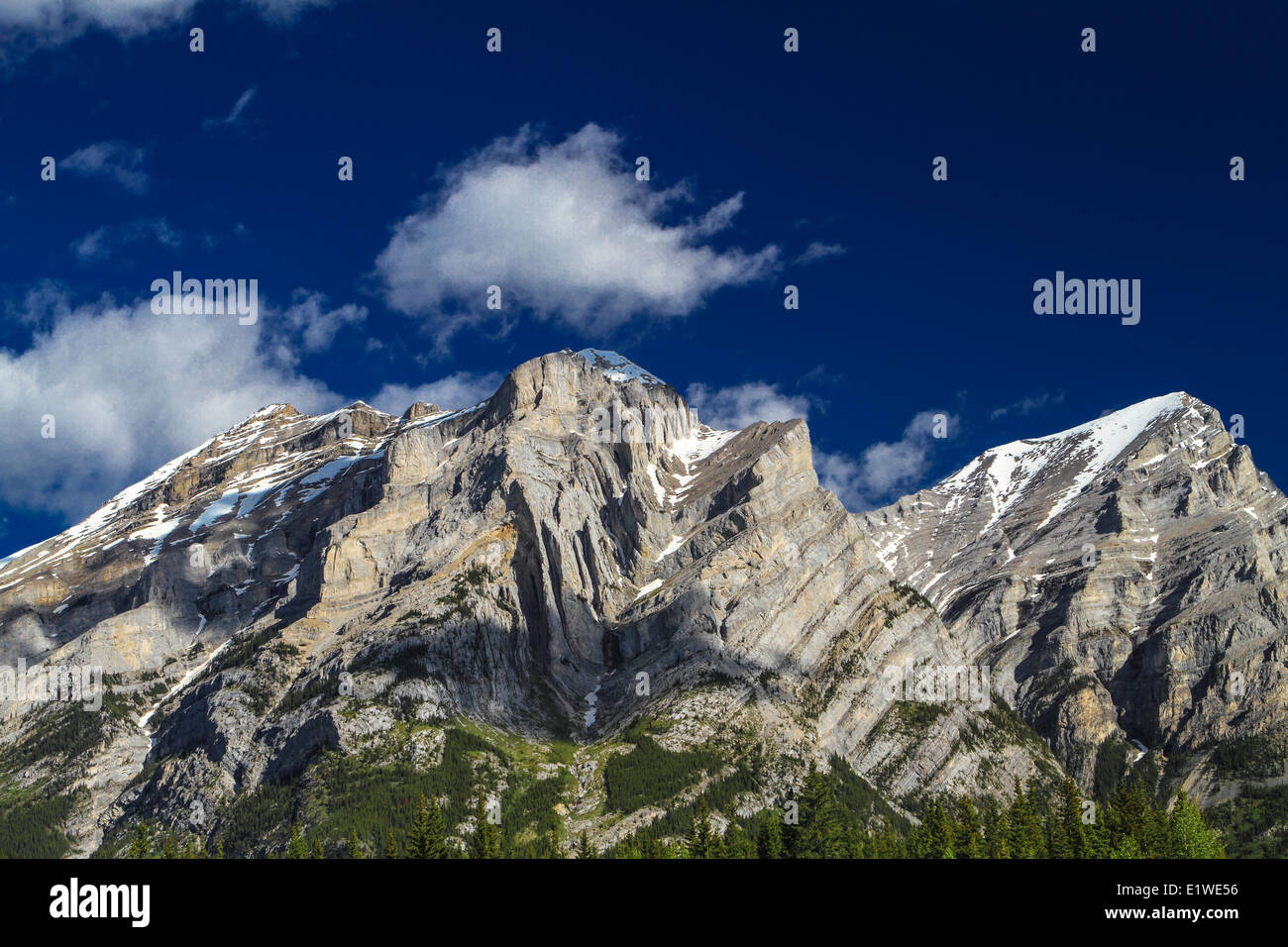 Mount Kidd with blue sky and white clouds. Kananaskis, Alberta, Canada Stock Photo