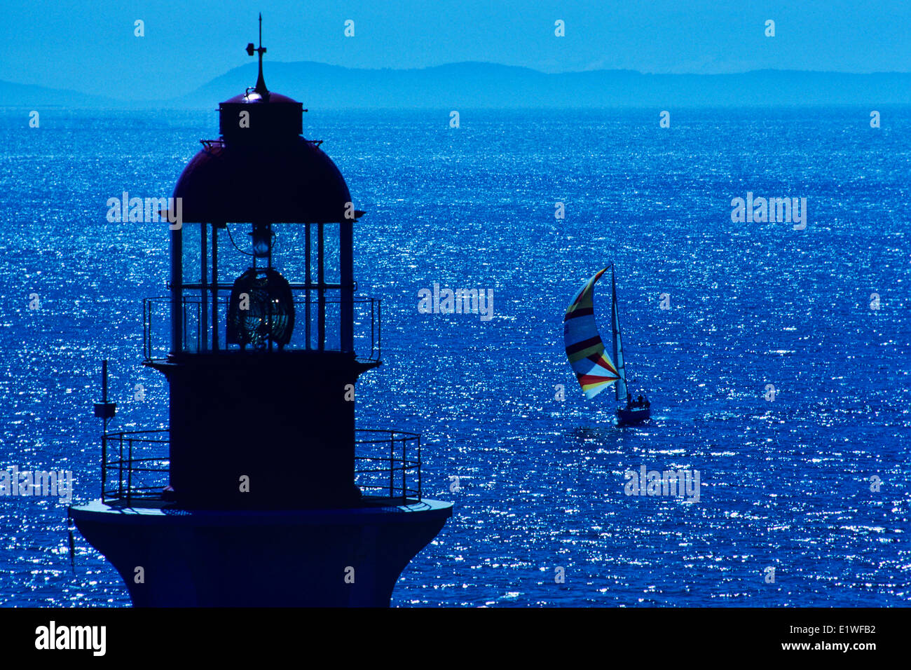 Point Atkinson Lighthouse and sailboat near Vancouver, British Columbia, Canada Stock Photo