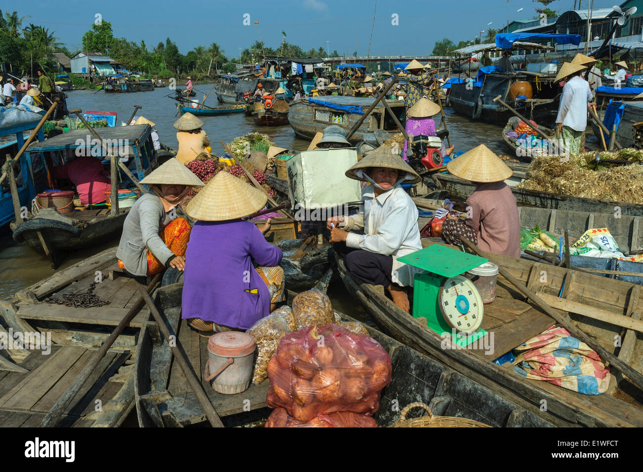 A group of vendors sell their produce at the floating market in the Mekong Delta region of Southern Vietnam, Socialist Republic Stock Photo