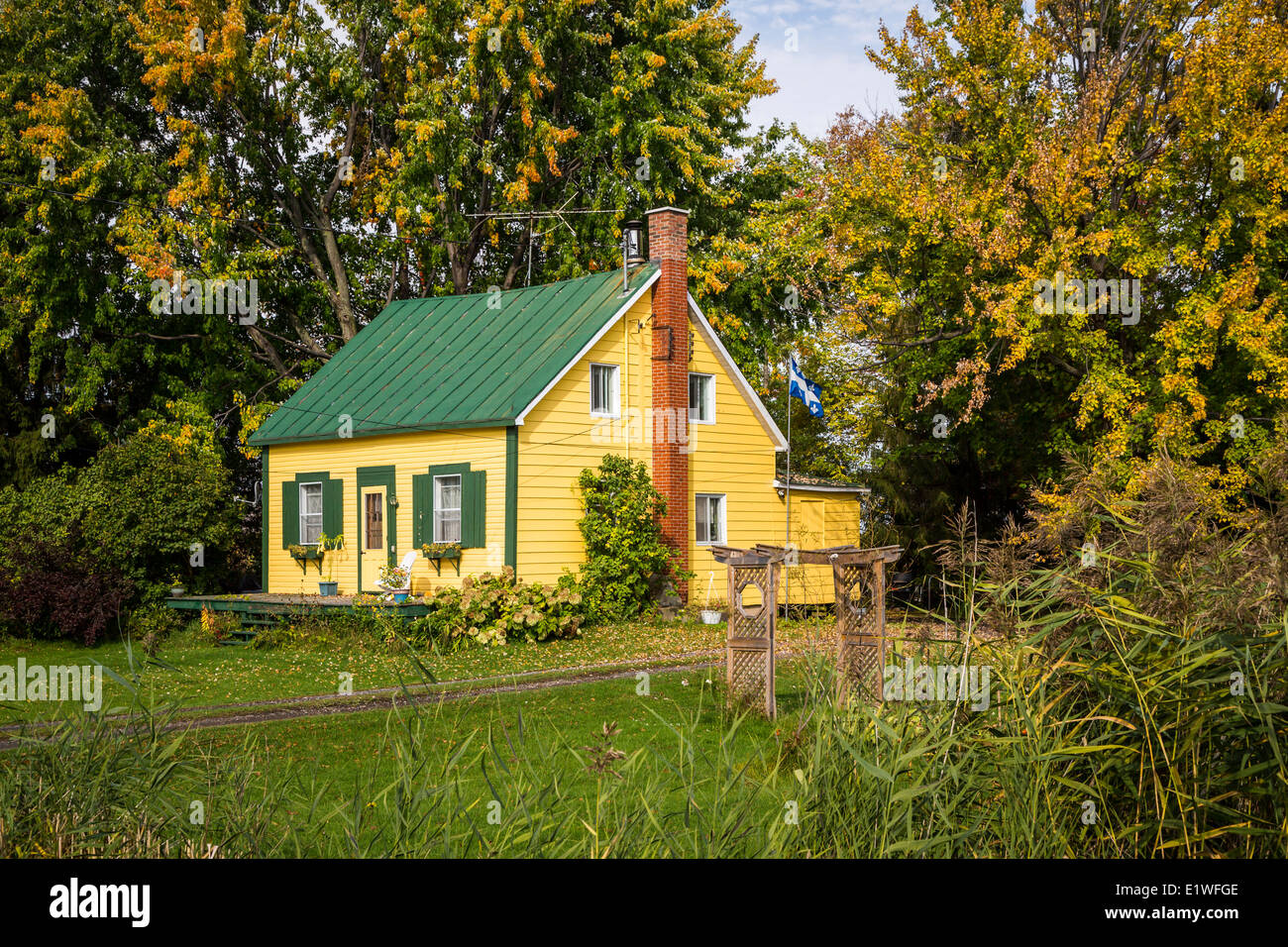 A rural Quebec home in the countryside with fall foliage color near