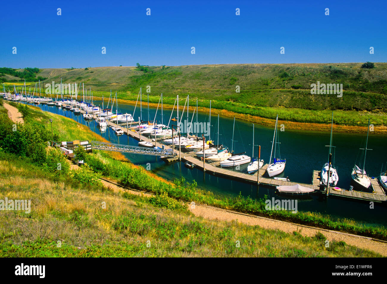 pleasure boats tied up at Elbow Marina, Lake Diefenbaker, Saskatchewan, Canada Stock Photo