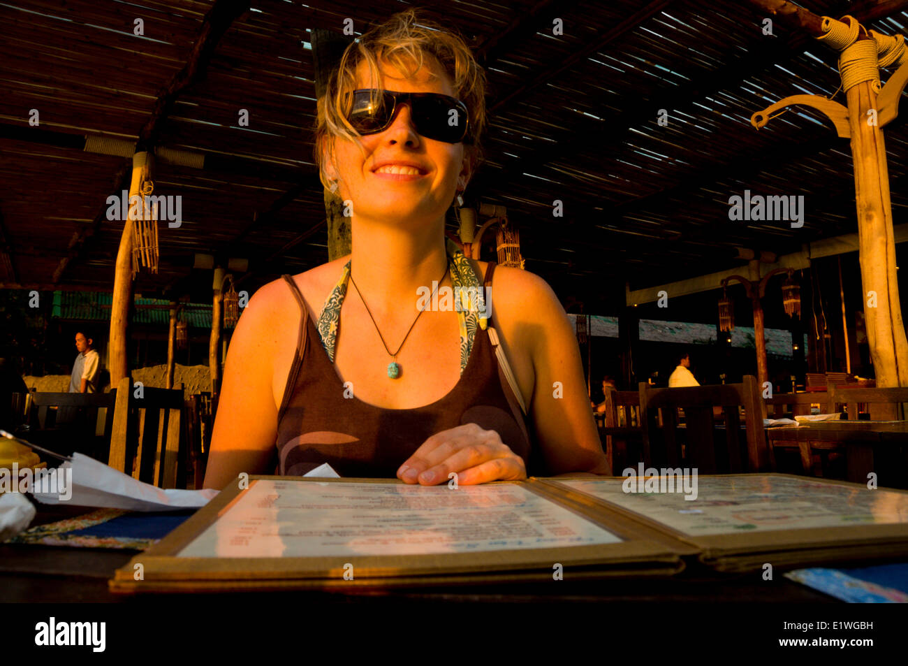 Happy about the menu at Railay Beach, Thailand Stock Photo