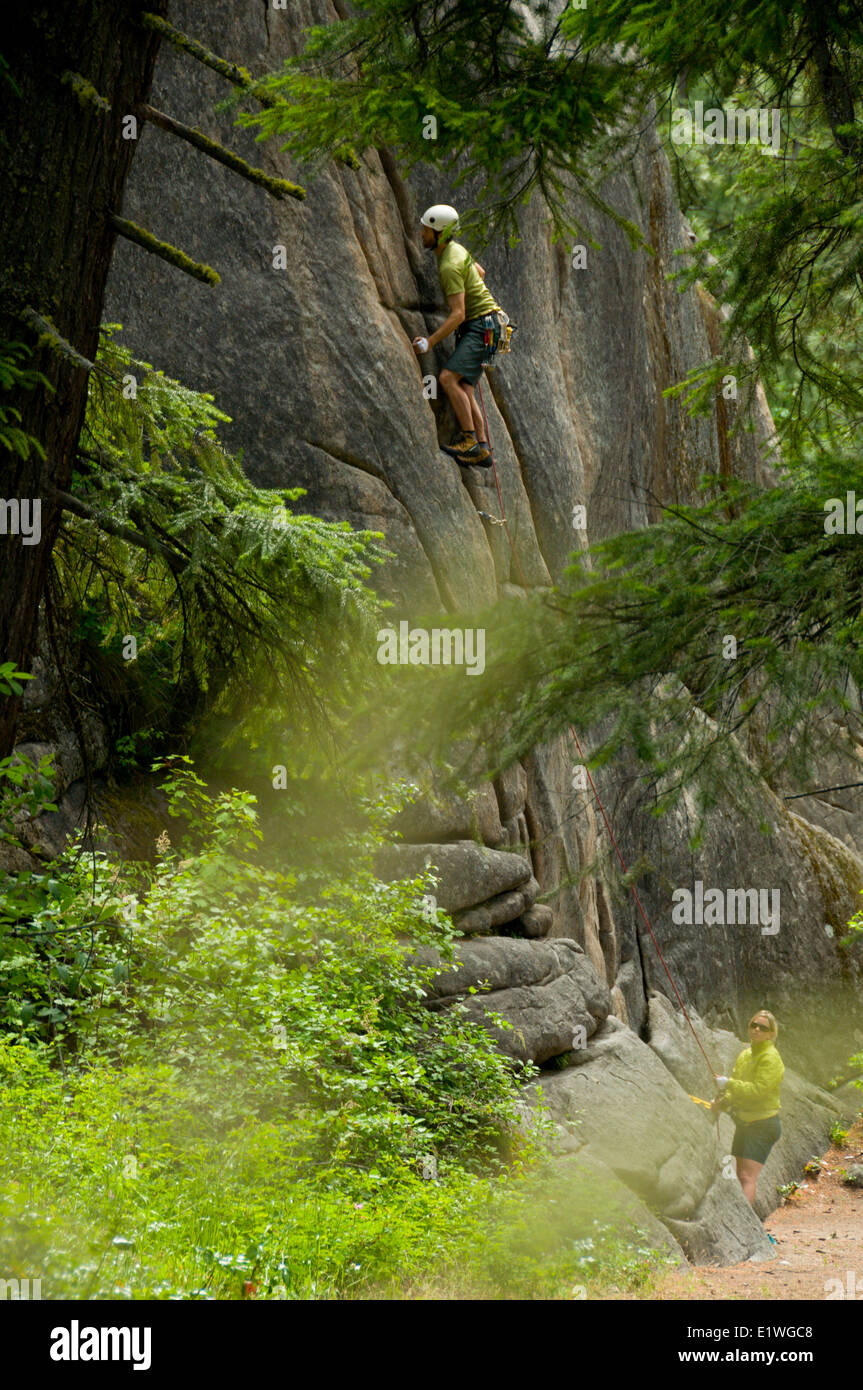 A climber ascends a cliff in Leavenworth, Washington Stock Photo