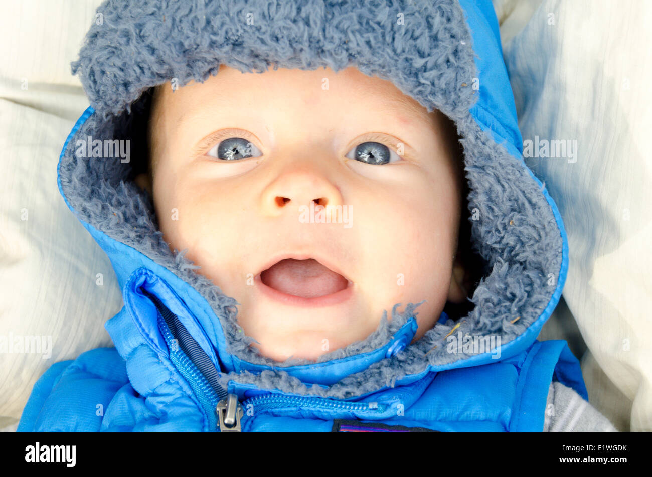 A six-month-old baby all bundled up for going outside Stock Photo