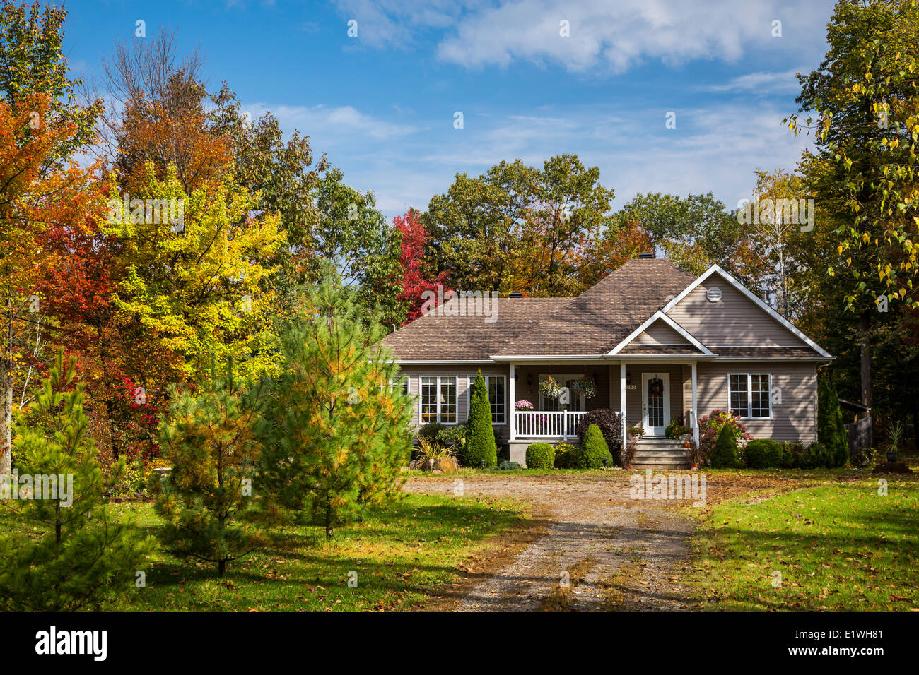 A rural Quebec home in the countryside with fall foliage color near Saint Rosalie, Quebec, Canada. Stock Photo