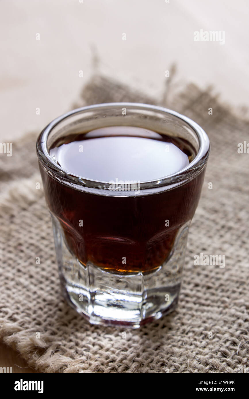 shot of alcohol on wooden table, close up photo Stock Photo Alamy
