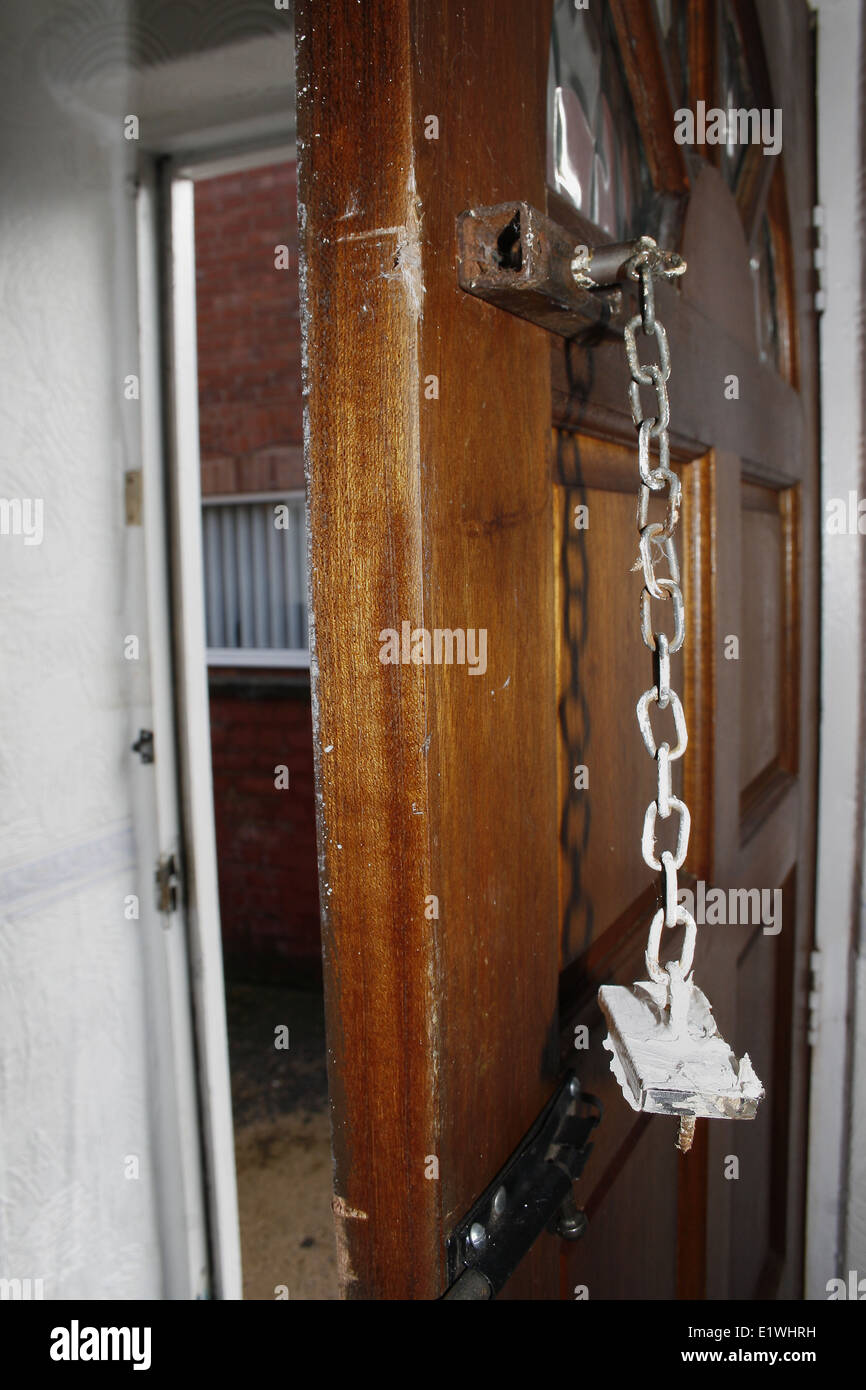 image of busted door chain hanging down Stock Photo Alamy