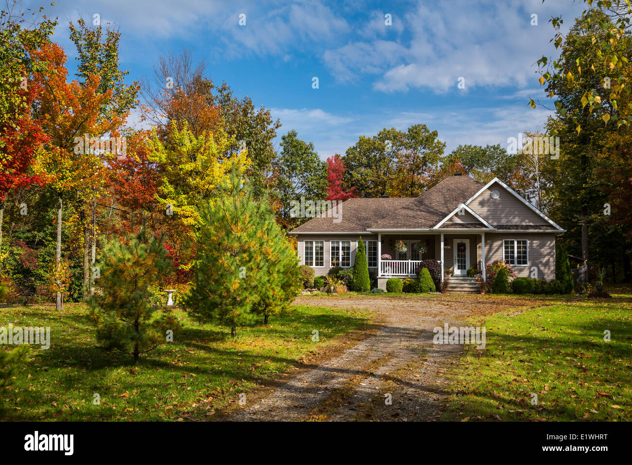 A rural Quebec home in the countryside with fall foliage color near Saint Rosalie, Quebec, Canada. Stock Photo