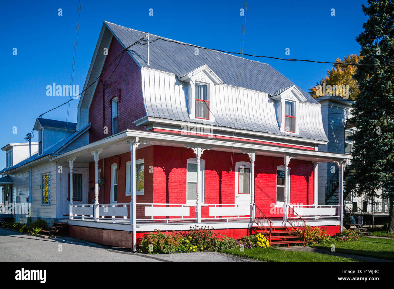 A rural Quebec home in the countryside with fall foliage color near