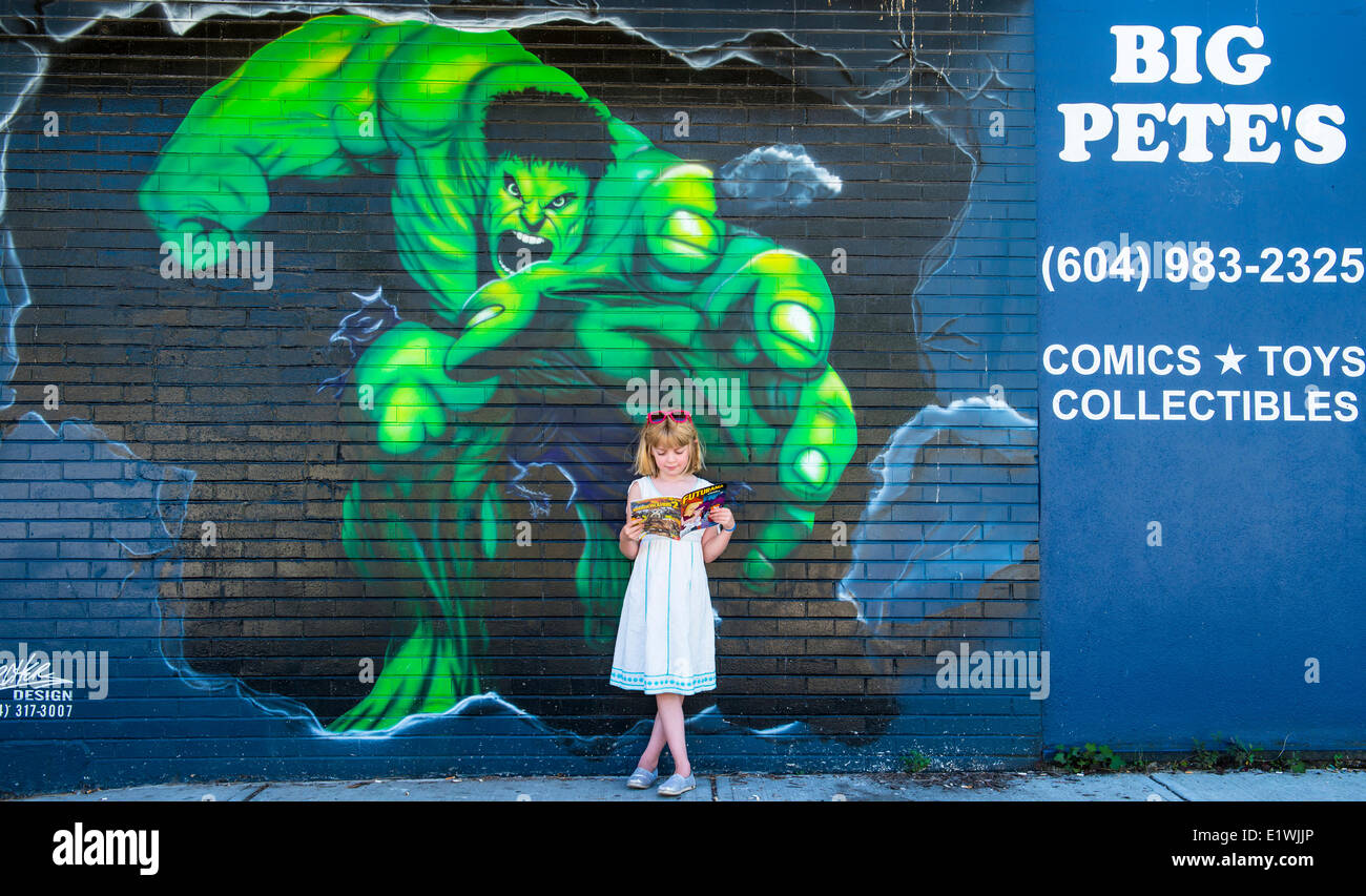 Girl in front of mural. M.R. Stock Photo