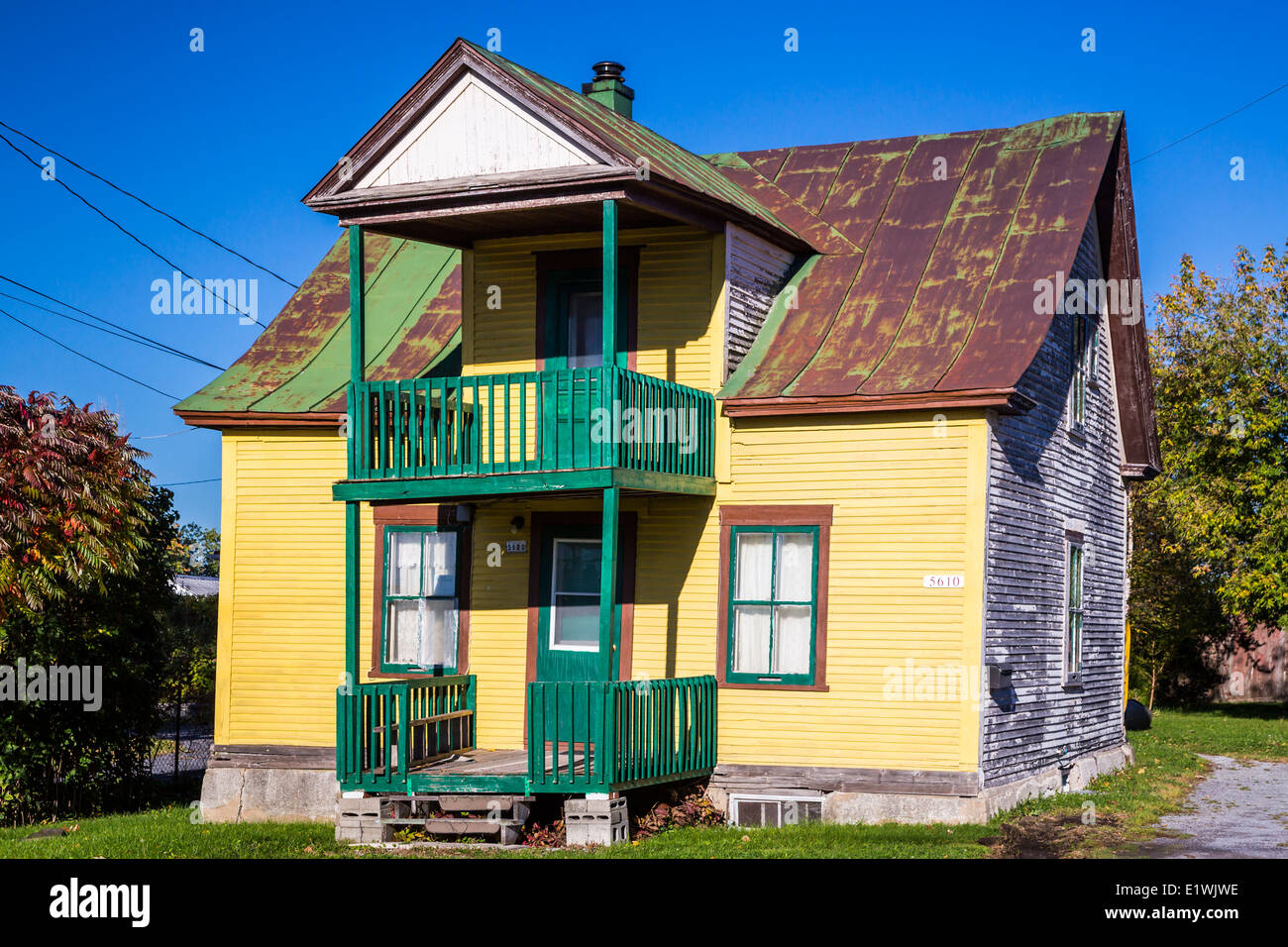A rural Quebec home in the countryside with fall foliage color near