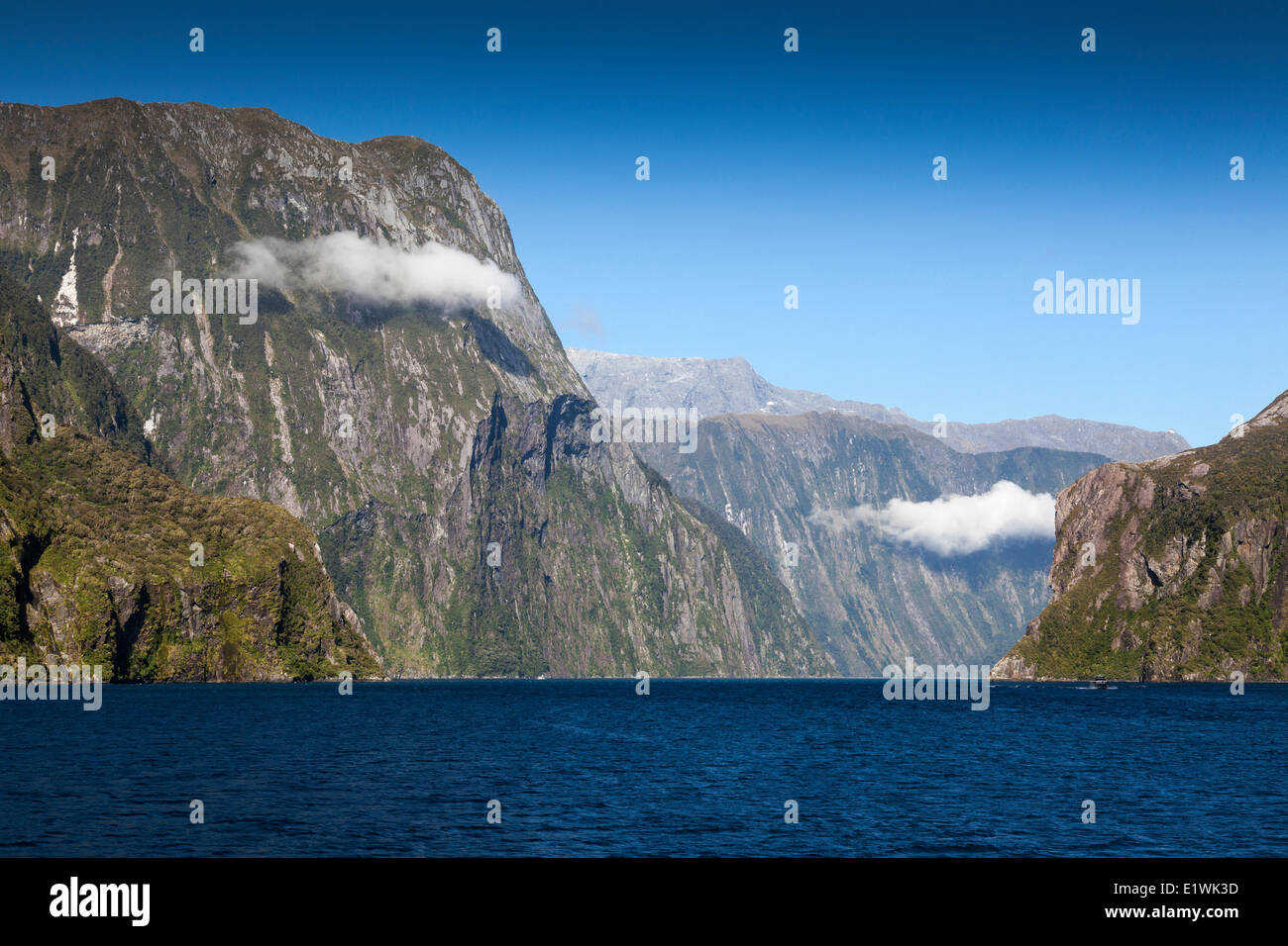Milford Sound seen from a tour boat coming back into the fjord from the Tasman Sea, Fiordland National Park, New Zealand Stock Photo