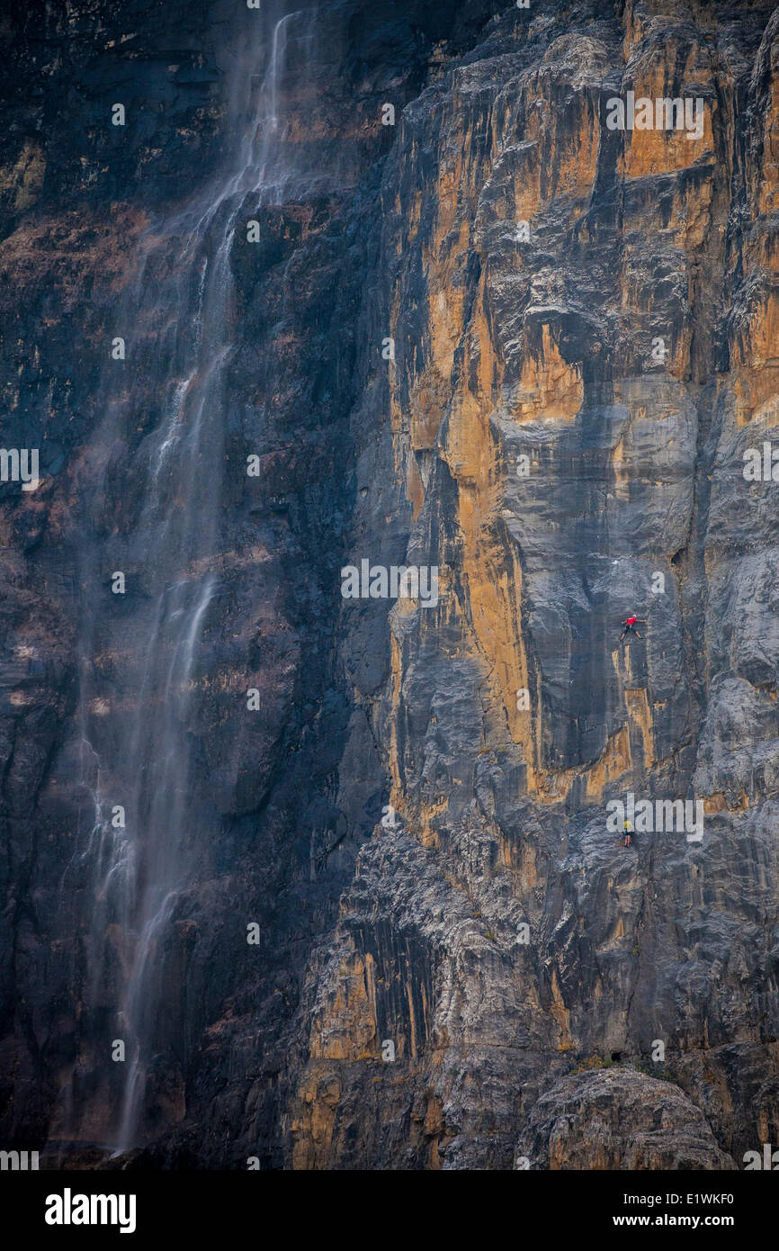 Two male climbers climbing a new multi pitch route on the stanley headwall, Kootenay National Park, BC Stock Photo