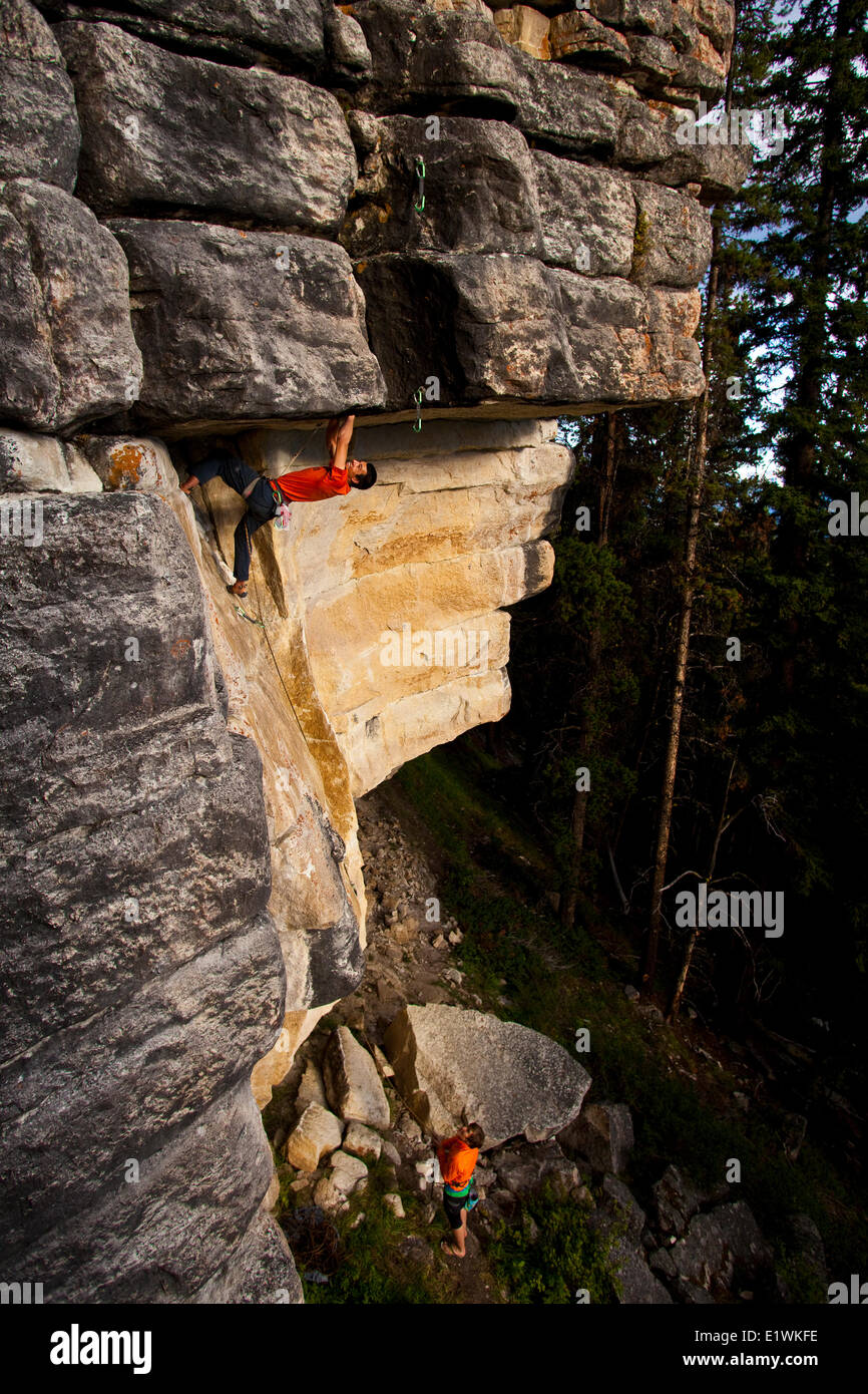 A strong male climber works on Supernatural zombie suspense thriller 11d, Silver City, Castle Mtn, Banff, AB Stock Photo