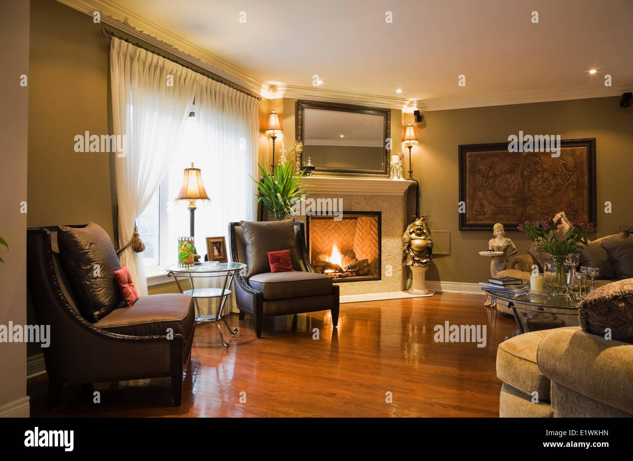 Family Room With A Gas Fireplace Hardwood Floor Inside A Luxurious