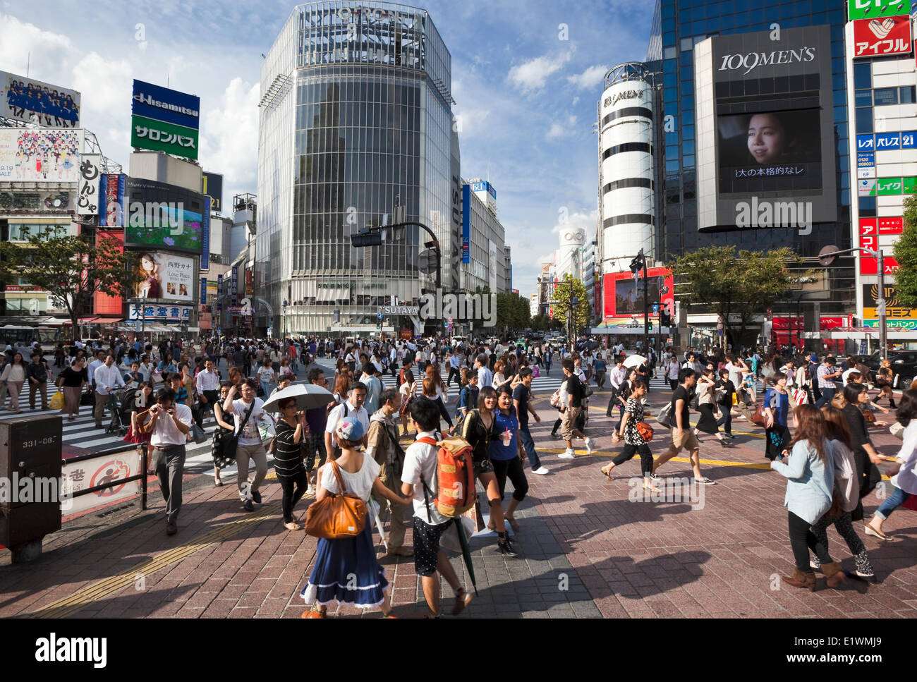 Famous Shibuya Crossing in Tokyo, Japan. Located next to the Shibuya train station, traffic lights stop vehicles coming from all Stock Photo