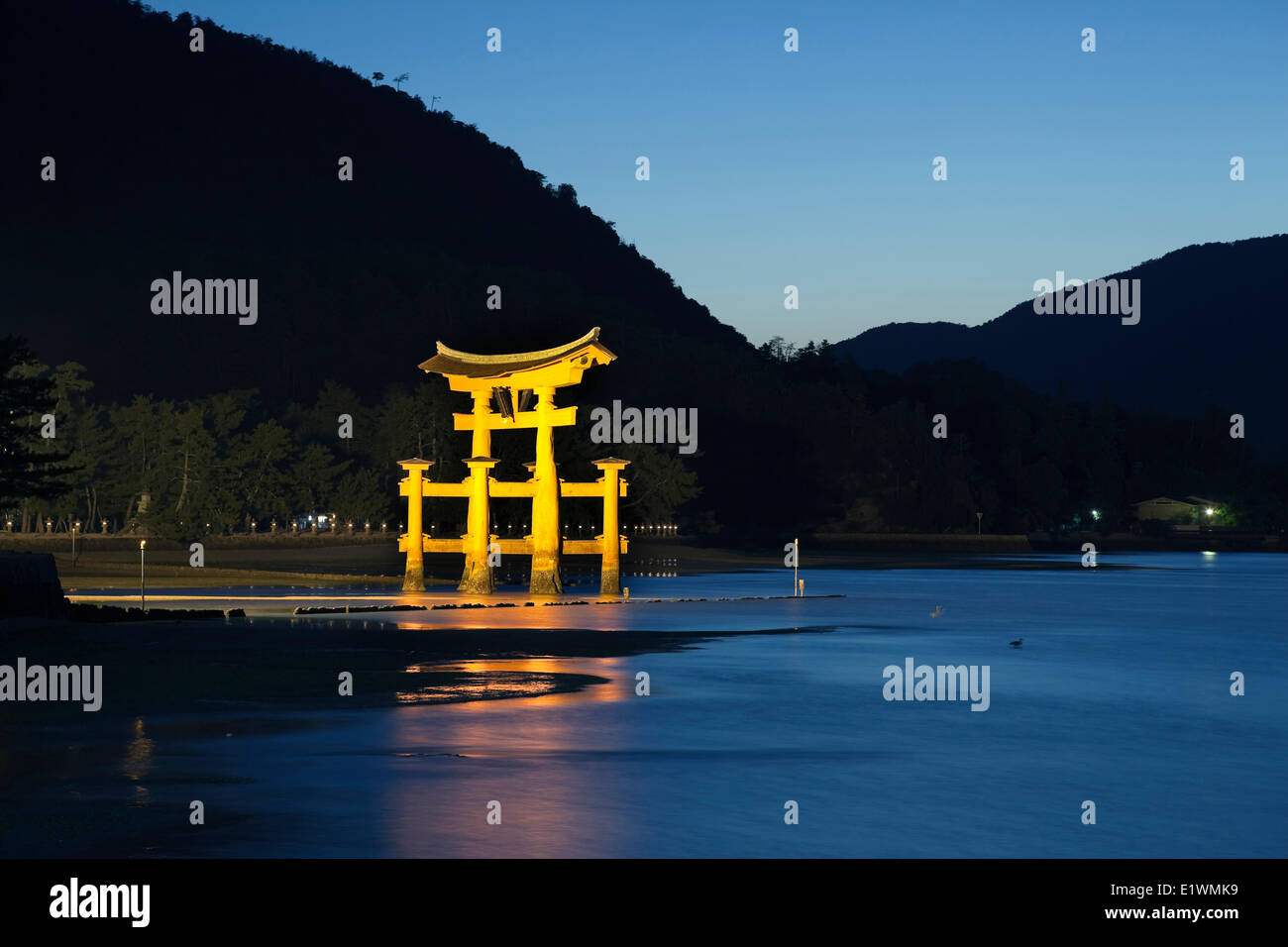 Nightime scene of the giant torii gate that is part of the Itsukushima Shrine complex on the island of Miyajima, Japan. Stock Photo