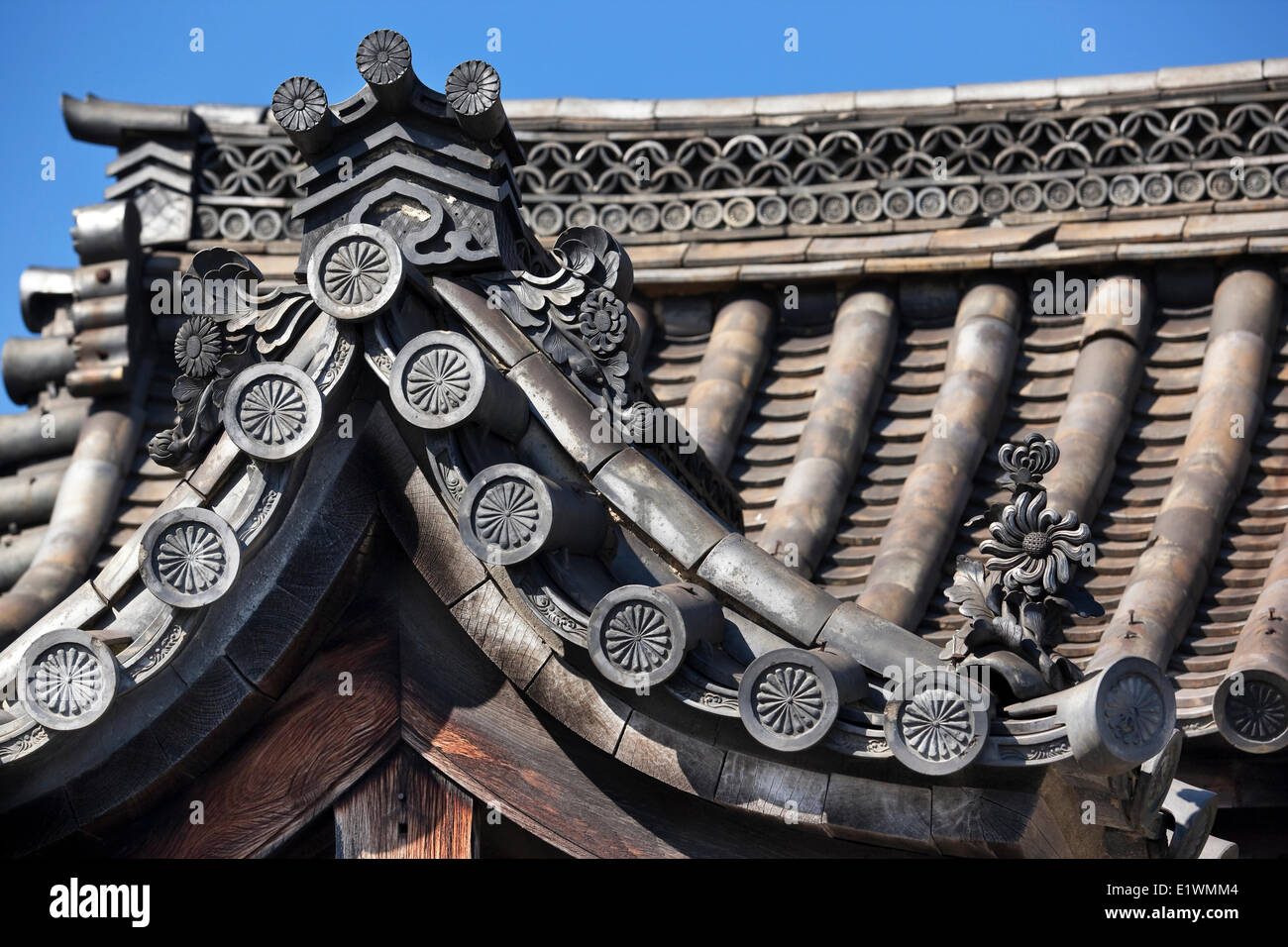 Architectural detail a curved roof eave Sanjusangendo Temple in Kyoto Japan. The roof is made ceramic tiles the design on the Stock Photo