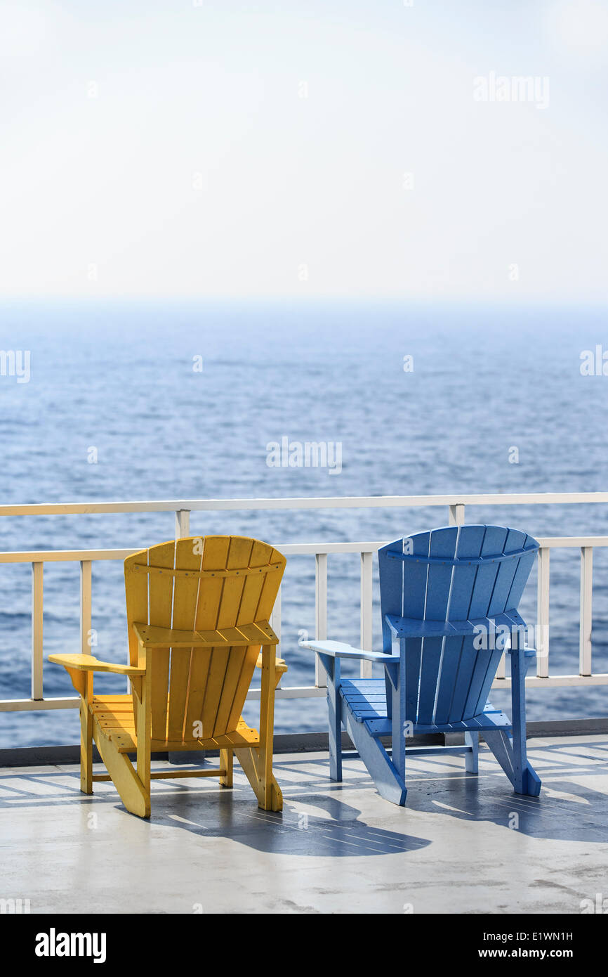 Muskoka chairs overlooking Georgian Bay on the MS Chi-Cheemaun Ferry, Lake Huron, Ontario, Canada Stock Photo