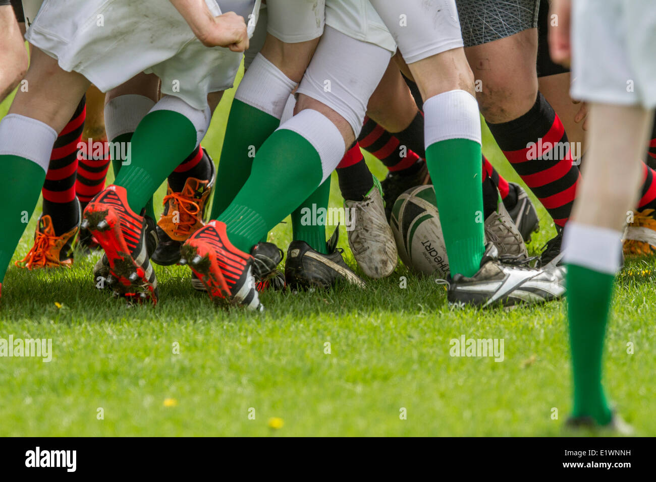 Rugby scrum of teenagers playing a game of rugby on a sunny day. Calgary, Alberta, Canada Stock Photo