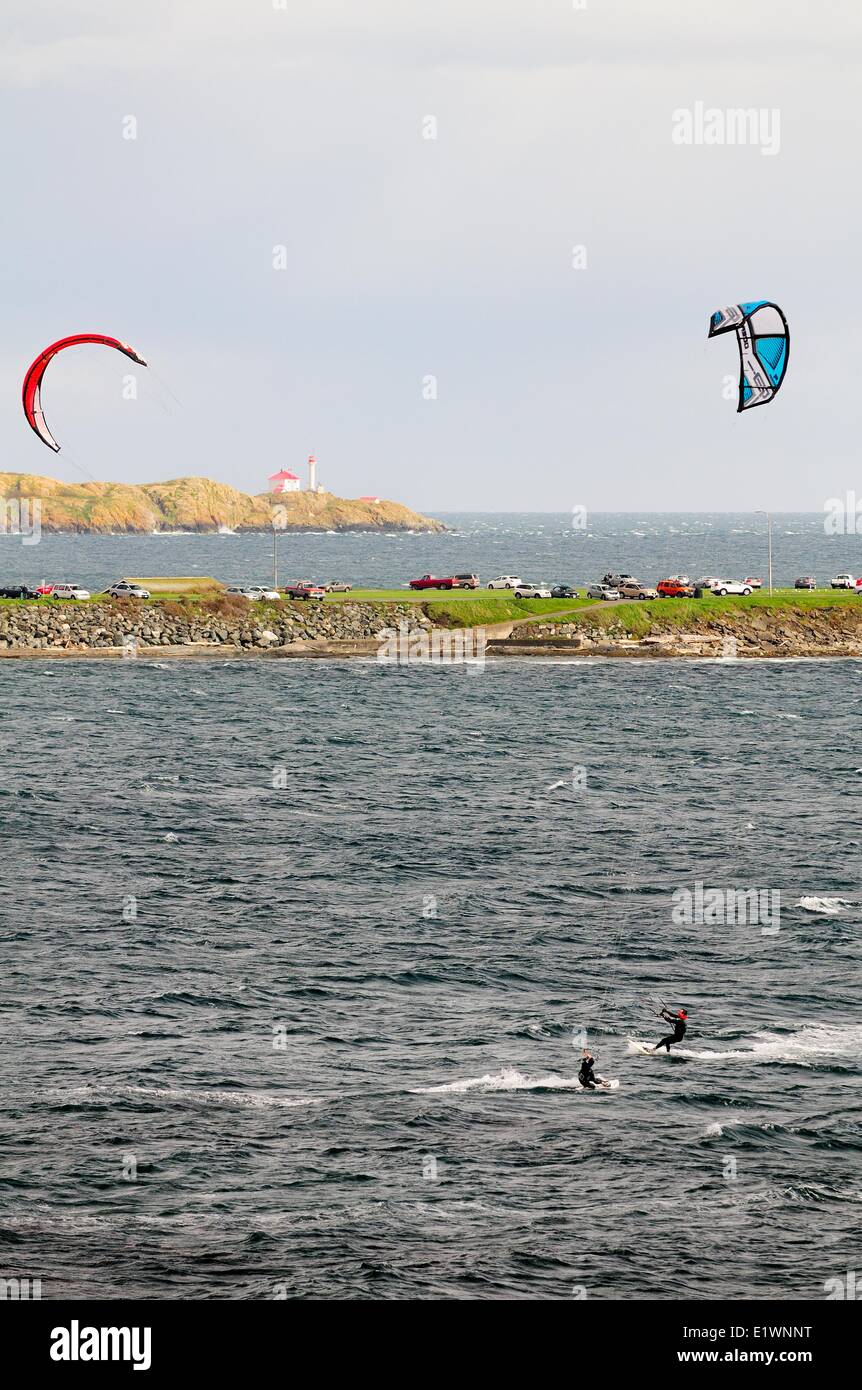 Two kite surfers surfing in the Strait of Juan De Fuca off Dallas Rd