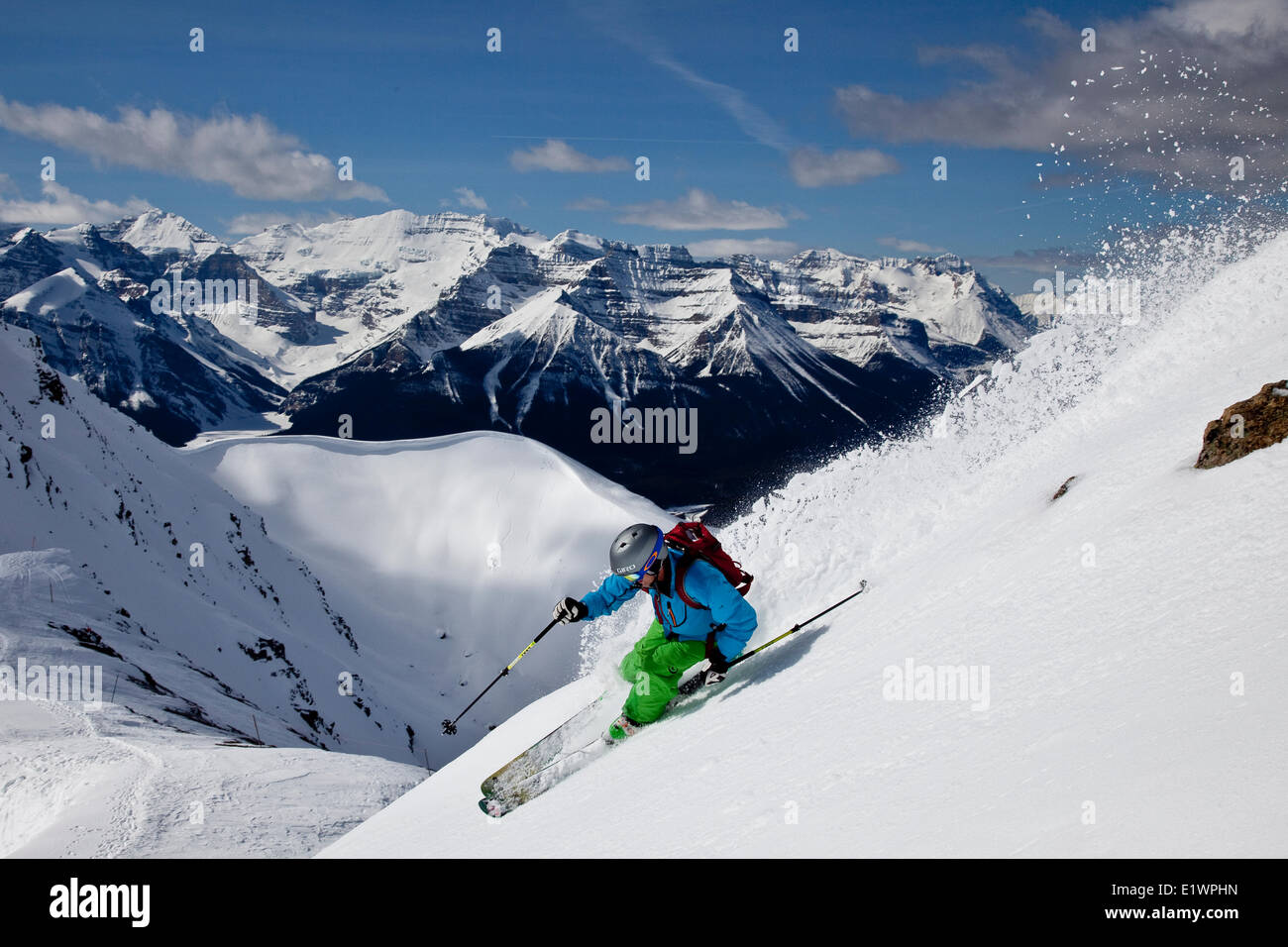 Young male skier skiing untracked slope at Lake Louise Ski Resort