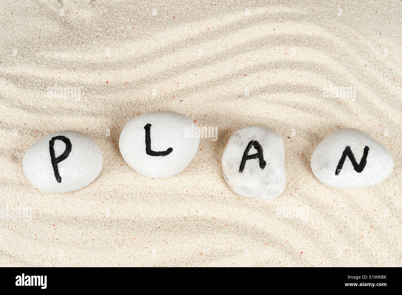 Plan word on group of pebbles Stock Photo