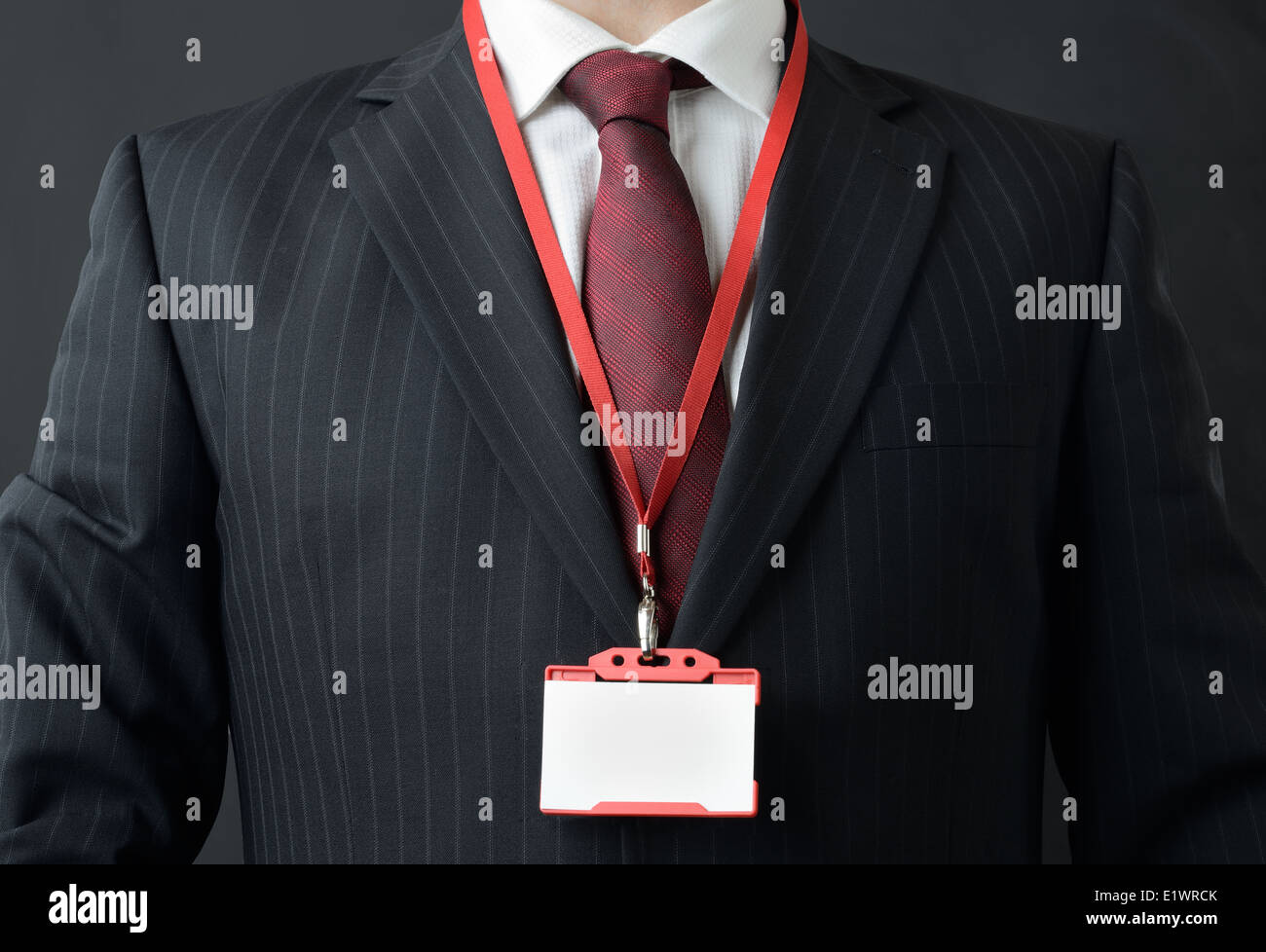 man in suit showing id or name badge Stock Photo