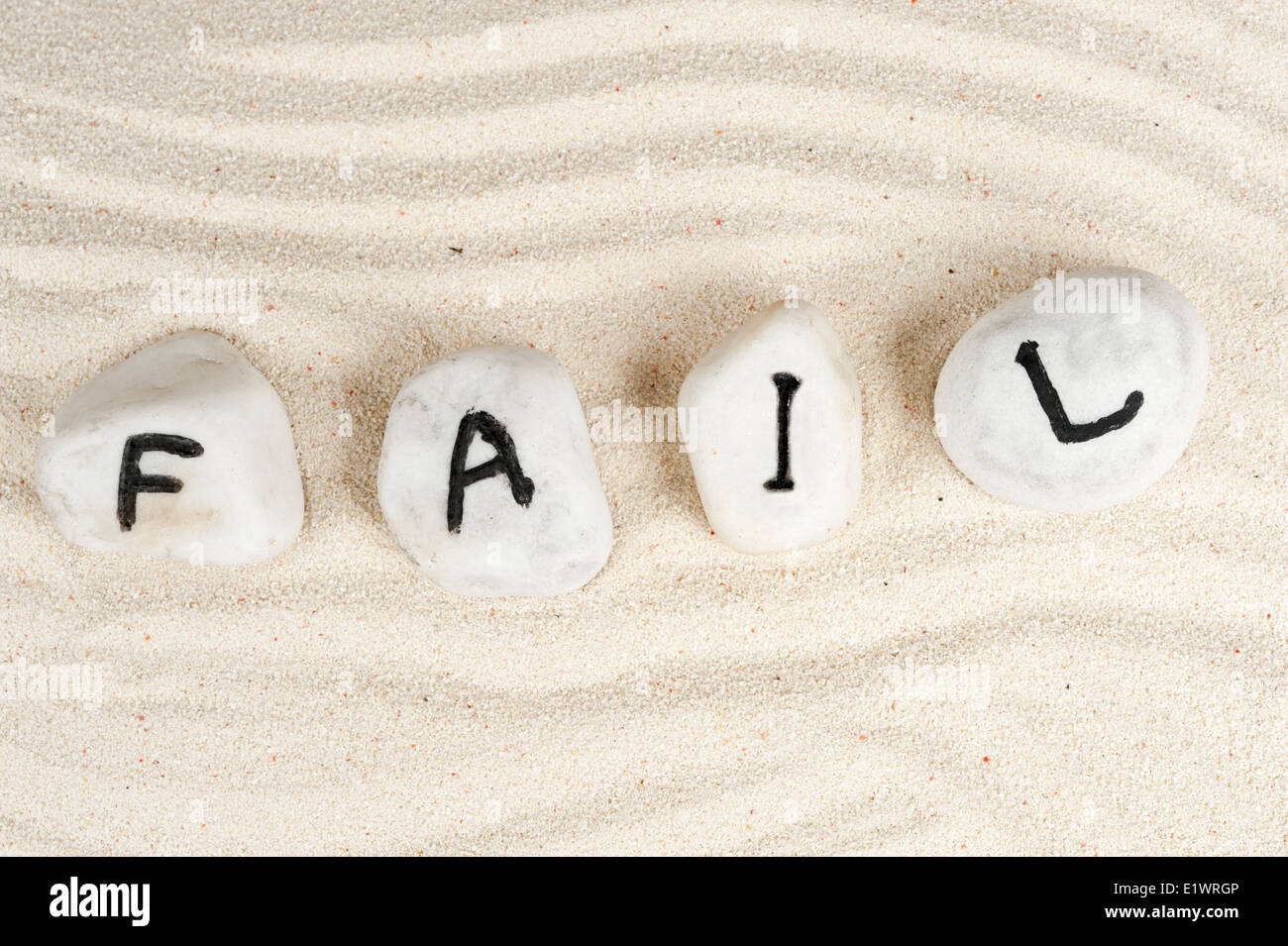 Fail word on group of pebbles Stock Photo